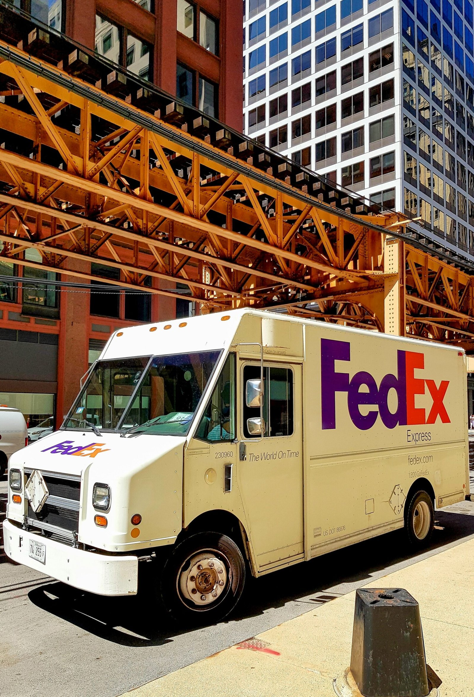 A fedex truck parked on the side of the road